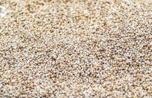 Detailed close-up of organic seeds showcasing a rich, natural texture in earthy tones.